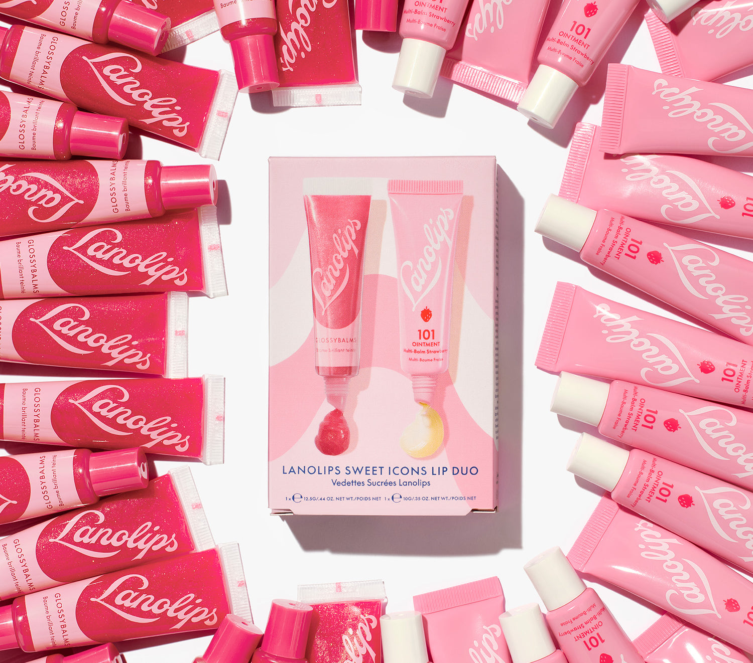 The Lanolips Sweet Icons Lip Duos contains our best selling Glossy Balm Candy - made with all-natural lanolin, vitamin e, with added gold and a fruity pink tint for an extra gloss-up. While our 101 Ointment Multi-Balm Strawberry is infused with vitamin e and natural strawberry fruit extracts to nourish dry lips. 
