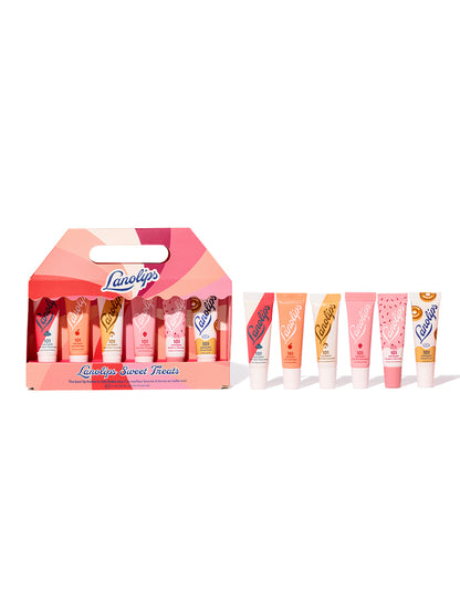 A collection of Lanolips lip balm tubes in various flavours, presented in a Christmas-themed packaging.