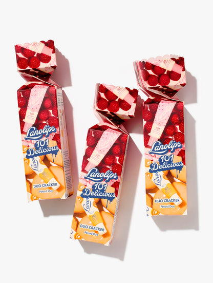 Limited edition Lanolips 101 Delicious Duo Cracker featuring two natural hydrating lip balms: Glazed Donut and Raspberry Shortcake.