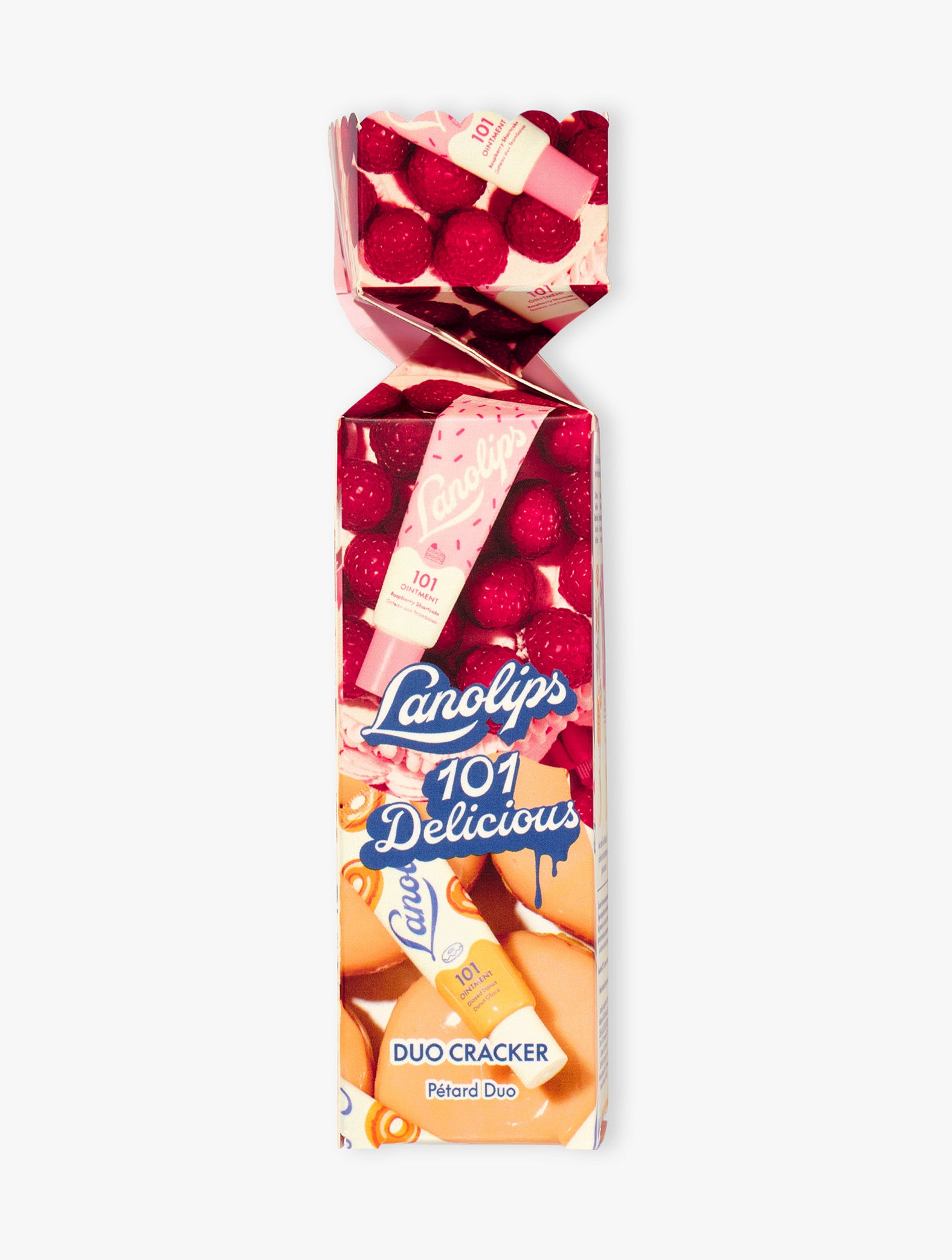 Product shot of the Lanollips 101 Delicious Holiday Cracker. The duo contains our best selling Glazed Donut and Raspberry Shortcake. Made with rich lanolin, vitamin-E and natural flavours for the ultimate hydration.